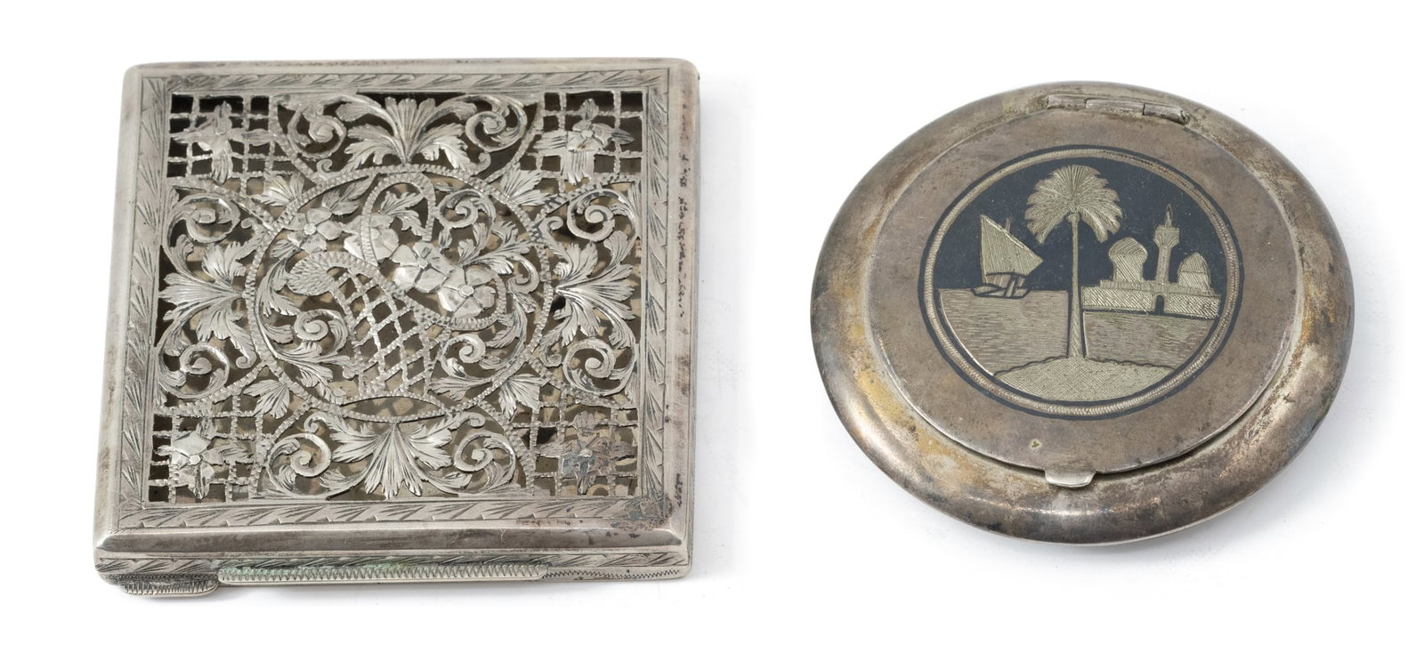 Two antique powder cases made of silver: Two antique powder cases made of silver, not signed, but the purity of the silver has been checked and it is 925 (sterling), the round powder ring is decorated with Niello decorations and the square o