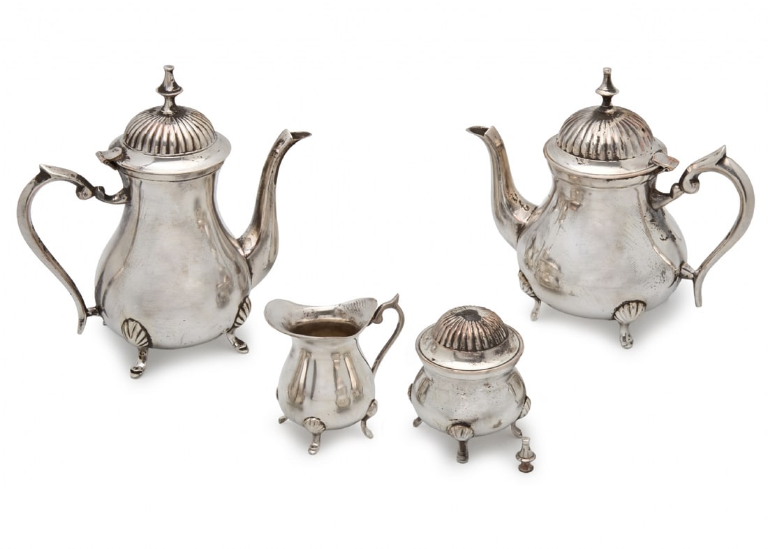 Coffee and Tea Serving Set Made of Silver-Plated Metal: Coffee and Tea Serving Set Made of Silver-Plated Metal, the set includes: teapot, coffee pot, sugar bowl, and milk/cream jug The sugar bowl handle is broken Height: 10-22 cm Notice: We are located in 