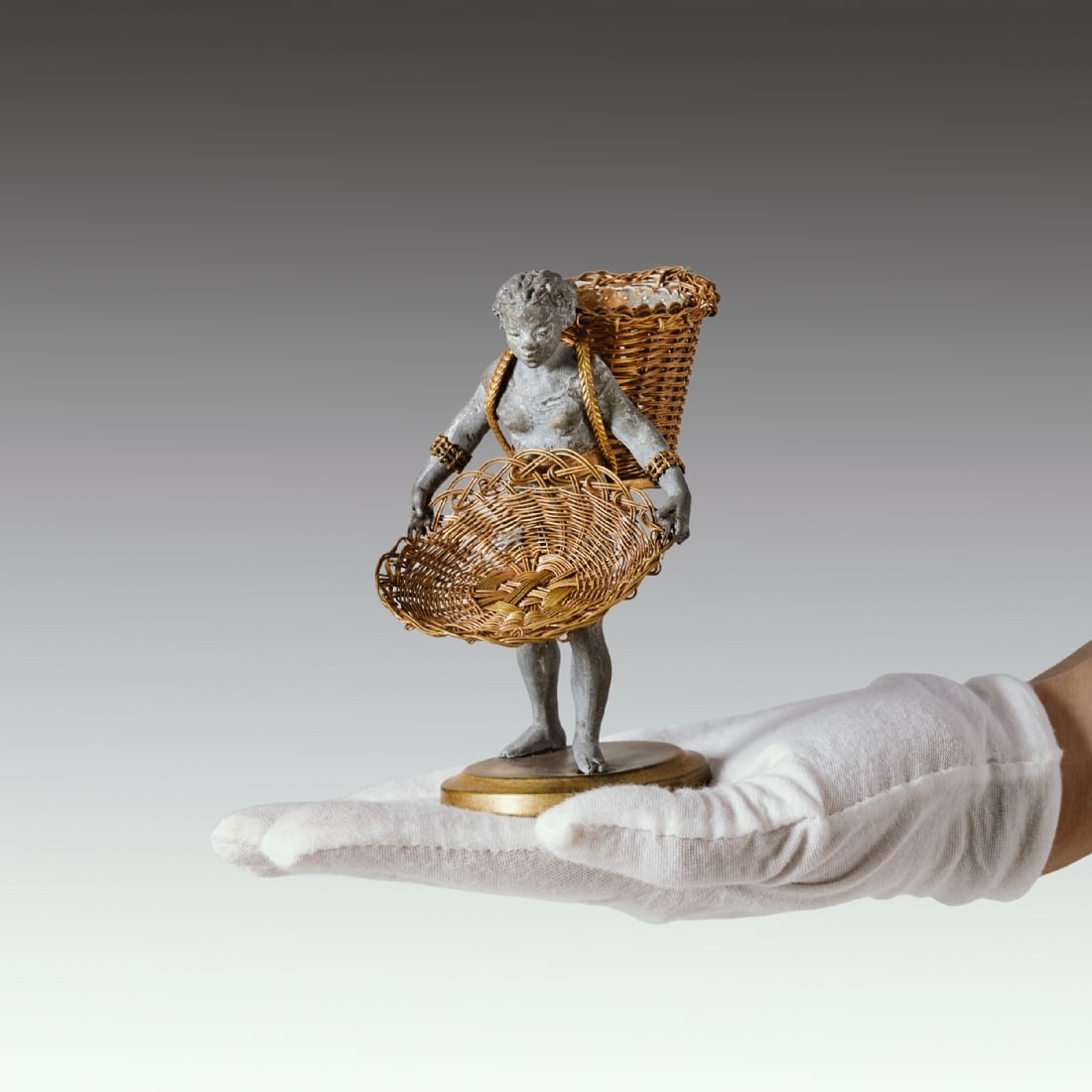Antique French 19th Century Table Decoration of a Woman Carrying Baskets: Antique French 19th Century Table Decoration of a Woman Carrying Baskets, made of pewter with gilded copper wires and a weighted copper base, circa 1840-1860 Height: 12.5 cm Width: 10.5 cm Notice: We 