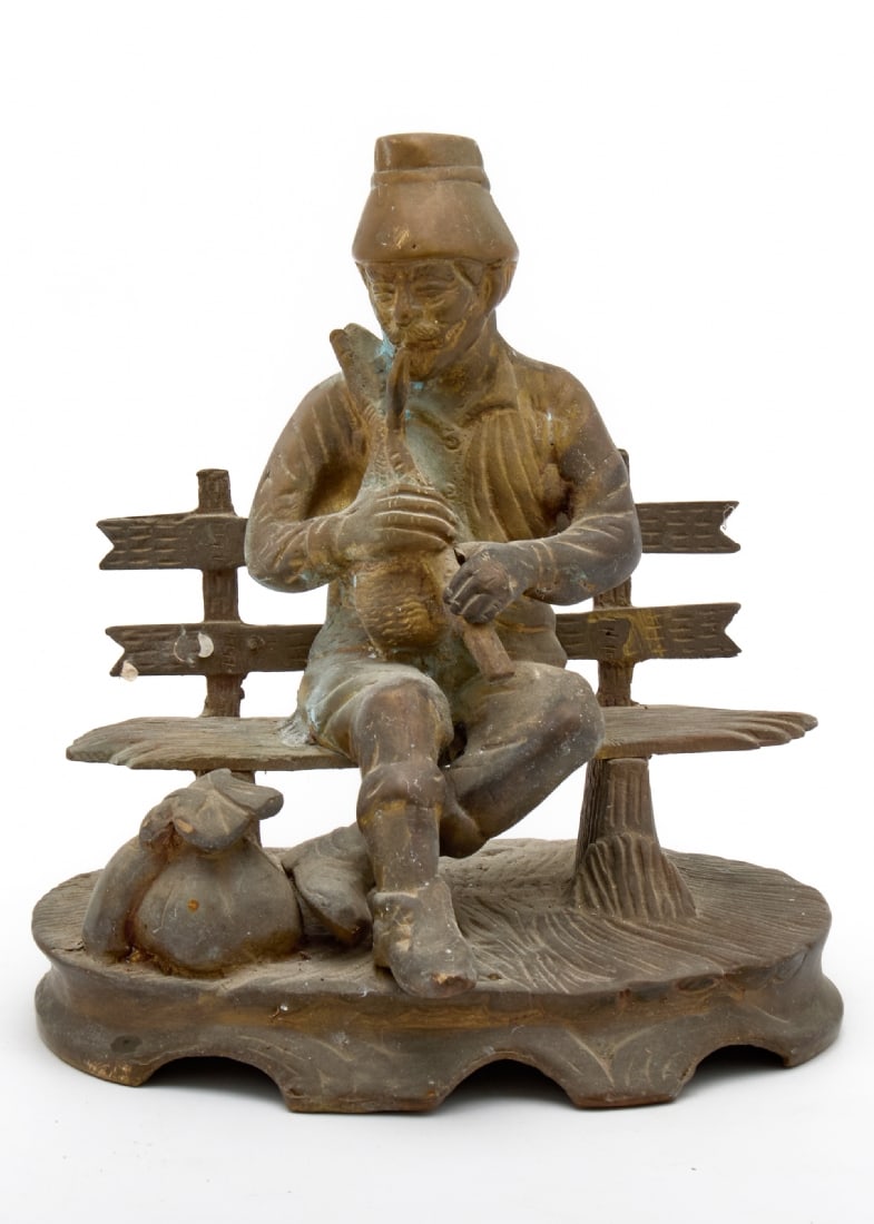 Brass Figure of a Man Sitting on a Bench Playing a String Instrument: Brass Figure of a Man Sitting on a Bench Playing a String Instrument, traditional attire with a hat, detailed casting work Dimensions: 18X17 cm Notice: We are located in Israel and provide full packin