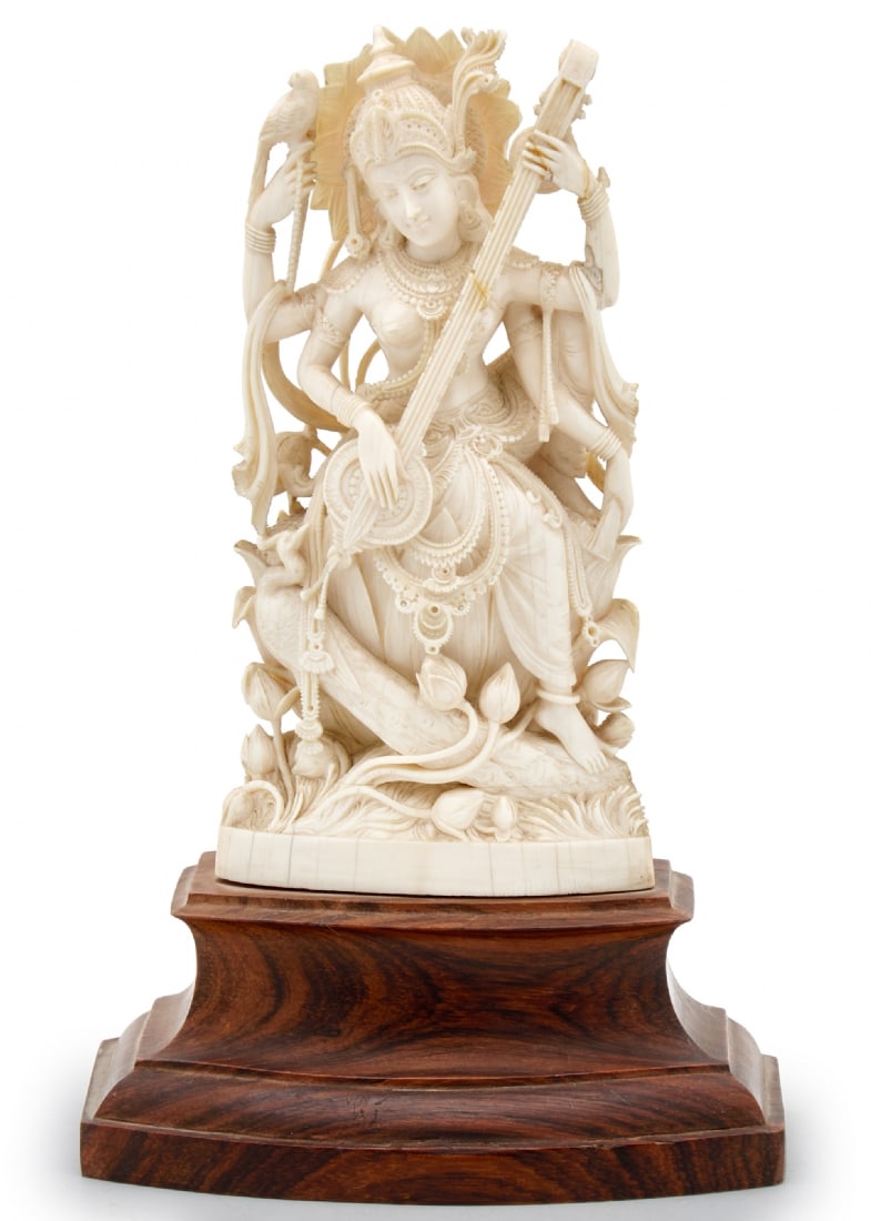Antique Indian Statue of Exceptional Beauty and Quality Made of Luxurious White Material: Antique Indian Statue of Exceptional Beauty and Quality Made of Luxurious White Material, hand-carved by an artist in the image of the goddess Saraswati, wooden base Base width: 15 cm Total height inc