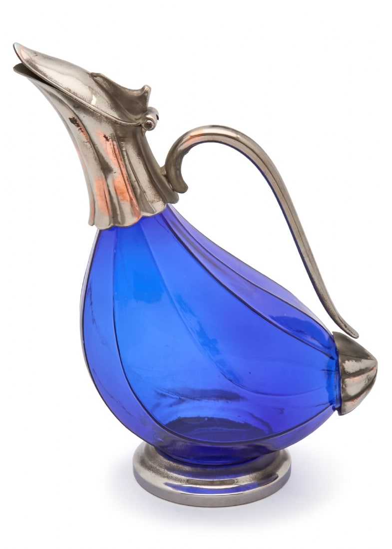 Cobalt Blue Glass Decanter with Metal Decorations on Neck and Handle: Cobalt Blue Glass Decanter with Metal Decorations on Neck and Handle, 1970s Scratches on metal Height: 26 cm Notice: We are located in Israel and provide full packing and shipping service. You can ask