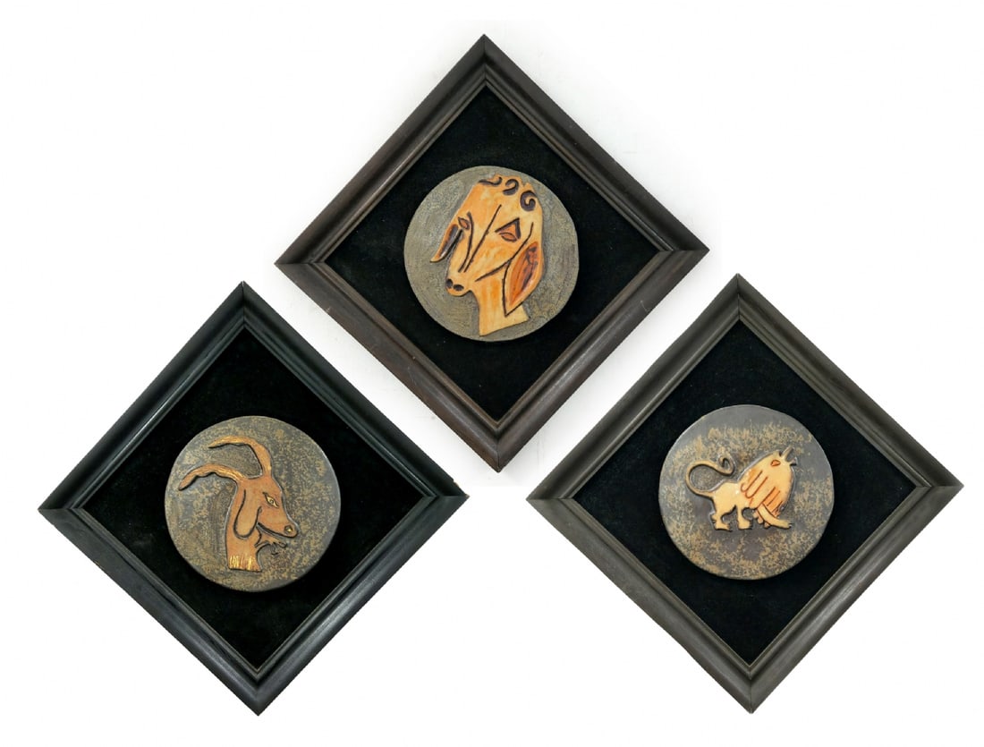 Three Ceramic Bas-Reliefs (Three Zodiac Symbols): Three Ceramic Bas-Reliefs (Three Zodiac Symbols), mounted on wooden panels Artist unknown, possibly an Israeli ceramicist Diameter of each ceramic medallion (bas-relief): 28 cm Framed dimensions: 48