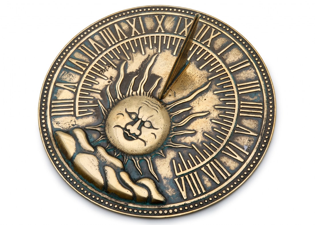 Decorative Brass Sundial with Smiling Sun Design and Roman Numerals: Decorative Brass Sundial with Smiling Sun Design and Roman Numerals, diameter: 26 cm Notice: We are located in Israel and provide full packing and shipping service. You can ask us for a shipping quote