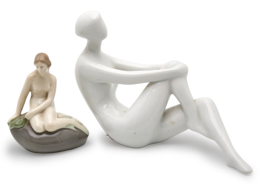 Pair of European Porcelain Sculptures Depicting Women by Royal Dux & Wagner & Apel: Pair of European Porcelain Sculptures Depicting Women by Royal Dux & Wagner & Apel, one, a nude woman by Royal Dux (signed at the base) Width: 21 cm The other, inspired by The Little Mermaid, signed H