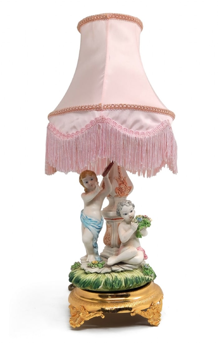 Decorative Table Lamp with Child Figures: Decorative Table Lamp with Child Figures, base decorated with classic-style child figures, with a light pink fabric shade and fringe edges Total height with shade: 47 cm Notice: We are located in Isra