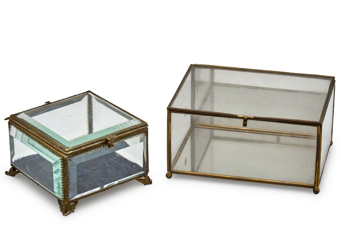 Pair of Tabletop Jewelry Boxes Made of Glass and Metal: Pair of Tabletop Jewelry Boxes Made of Glass and Metal, one decorated in a classic style with decorative legs Dimensions: 13X13X8 cm The other in a modern geometric design Dimensions: 18X9X13 cm