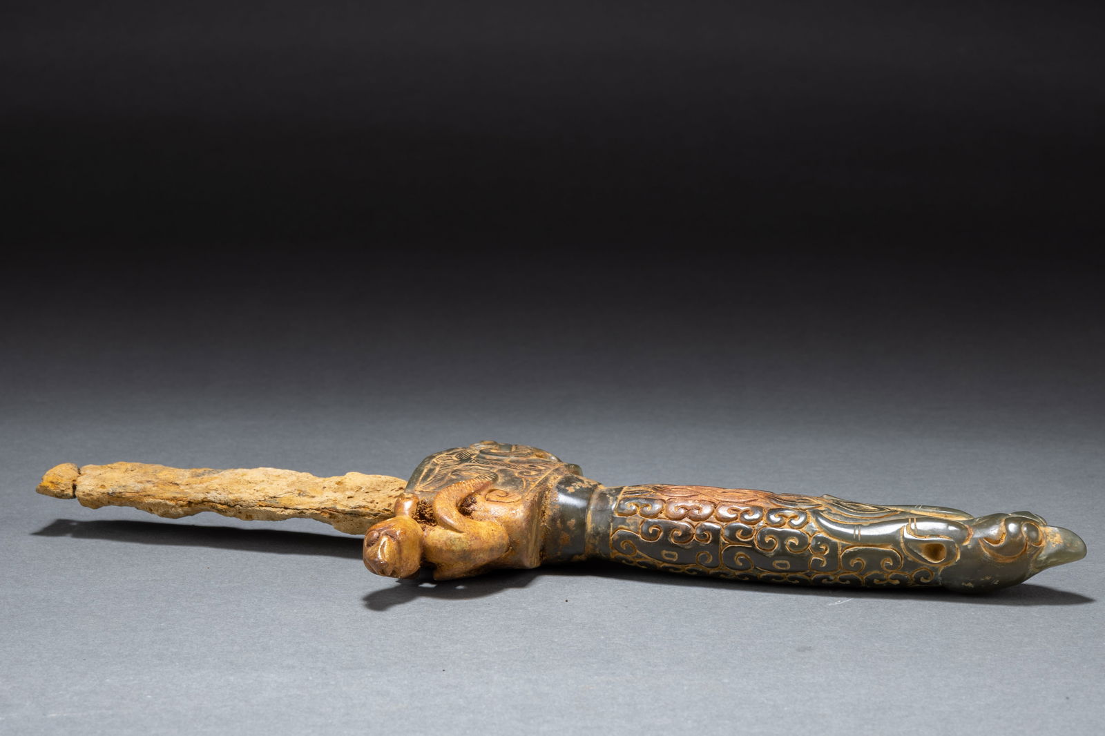Han Feng patterned jade sword handle: Provenance: From an old Norwegian private collection, and thence by descent in the same family. Acquired in Qingdao, China, in 1954, by the second mate of the Oakland (Holmen & Vaboen shipping company