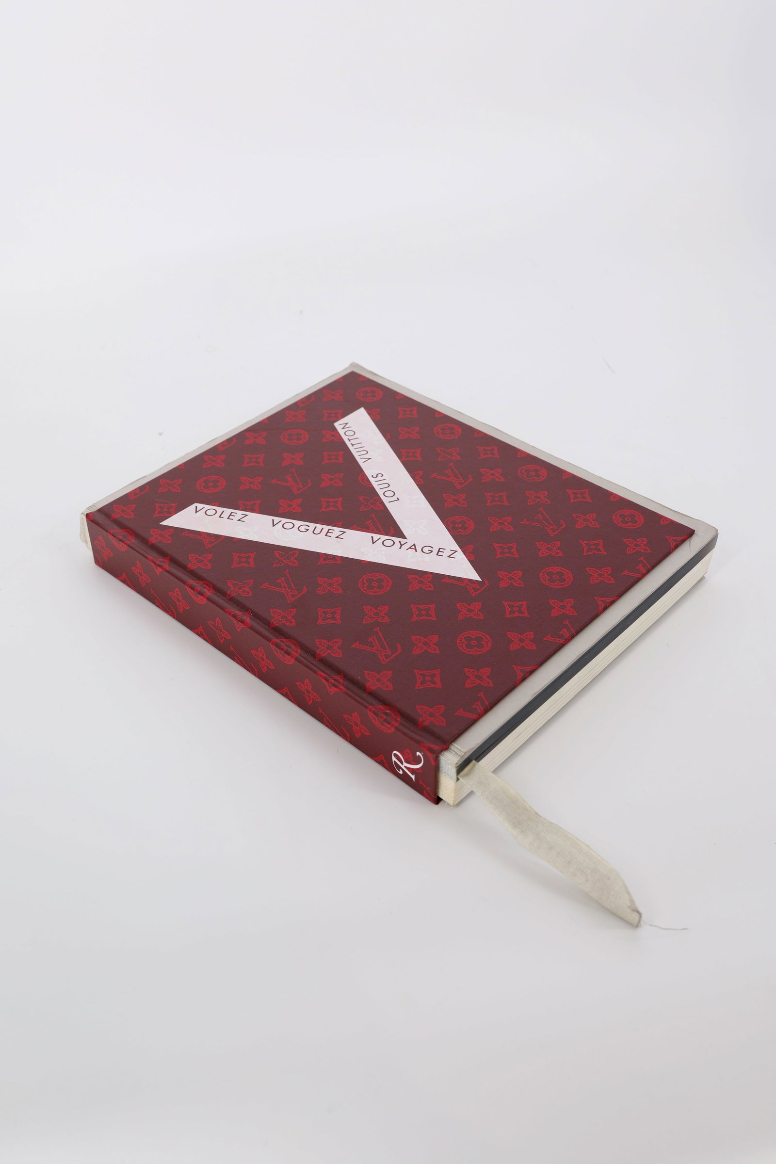Louis Vuitton Volez Voguez Voyagez - Louis Vuitton Catalog: This photographic album of the exhibition Louis Vuitton Volez, Voguez, Voyagez will be used for all the VVV exhibitions worldwide. The book is organized in 9 sections as in the exhibition and it conta