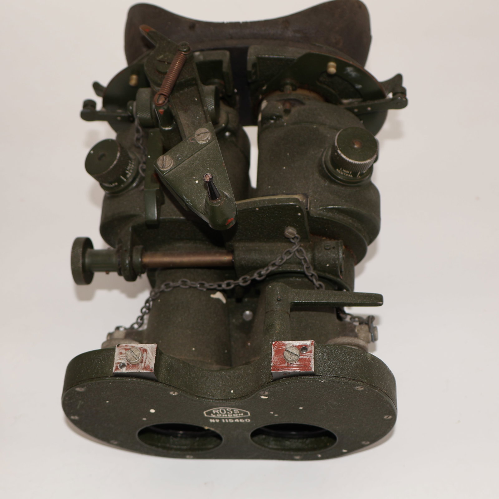 WWII Gas Mask Ross London Binoculars: The WWII Gas Mask Ross London Binoculars, marked with serial number 115460, serve as a compelling relic from a tumultuous era in history. These binoculars, originally produced by Ross London during Wo
