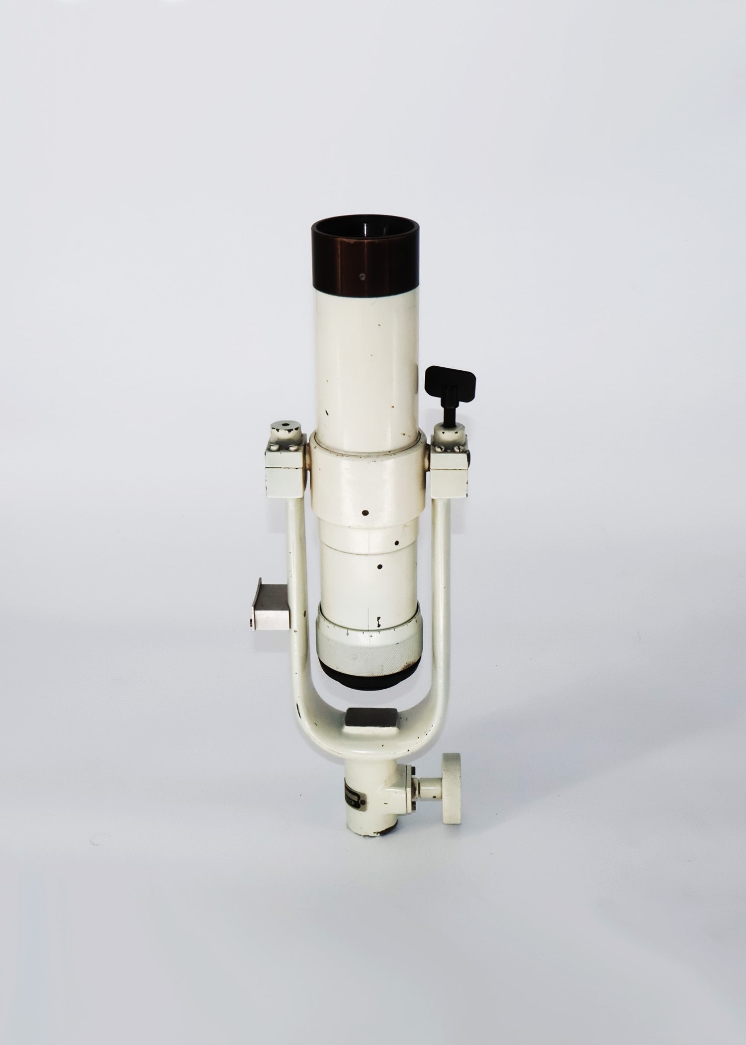 AT-1 Russian Telescope: Delve into the world of vintage astronomy with this captivating White and Black Antique Russian Telescope. Bearing the distinct markings "AT-1 No 0004721" and the Cyrillic inscription "Made In CCCP," 