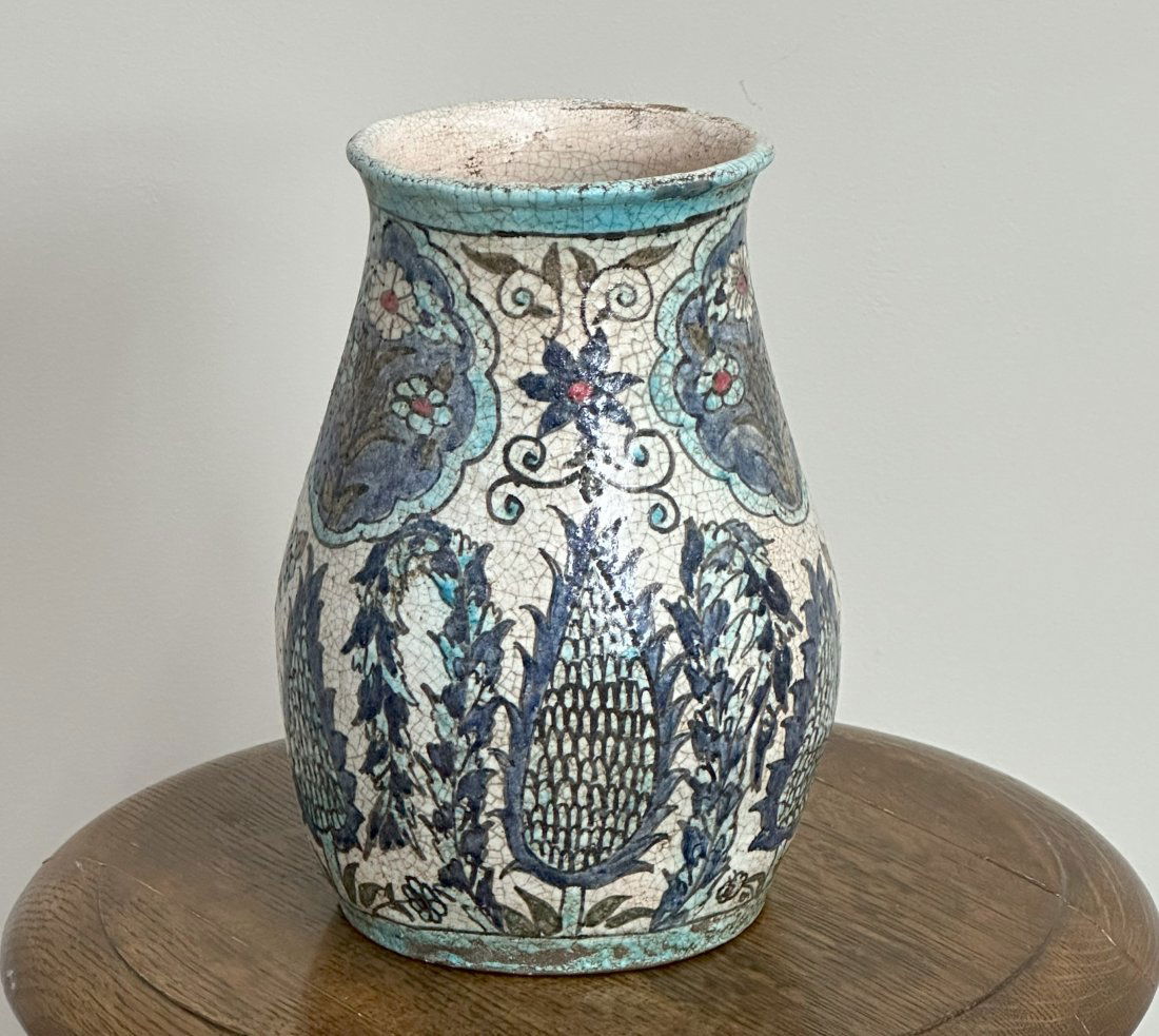 Middle eastern pottery jar with hand-painted floral details. (1 of 4)