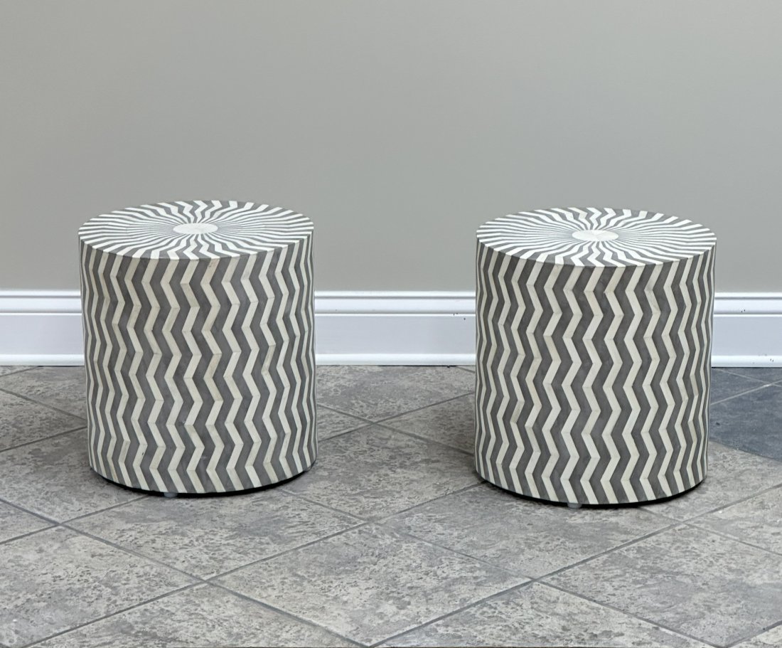 A pair of side tables adorned with exquisite bone inlay in a chevron design.: Presenting a meticulously crafted pair of hand-made round side tables adorned with striking bone inlay in a stylish chevron pattern. These tables are in excellent condition, each measuring 15 inches i