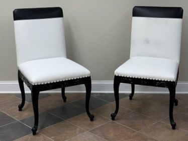 Pair of Designer Chairs in white and black vinyl upholstery with solid wood carved legs