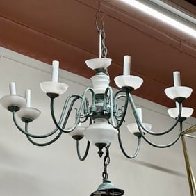 Old Rustic, Bronze or aged brass chandelier with eight lights.