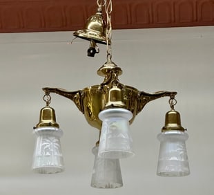 This chandelier looks antique and in good chape. It features four arms with light and nice.