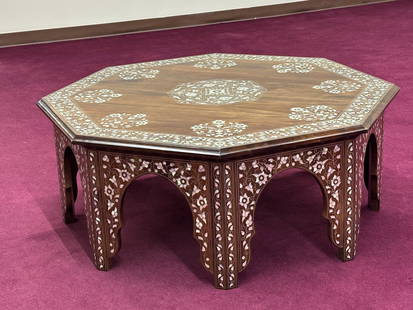 Syrian Walnut Coffee Table inlaid with mother of pearl: This coffee table is a traditional Syrian craftsmanship, hand-carved and meticulously inlaid with genuine mother of pearl. octagonal shape (48" W x 48" D x 19.5" H)