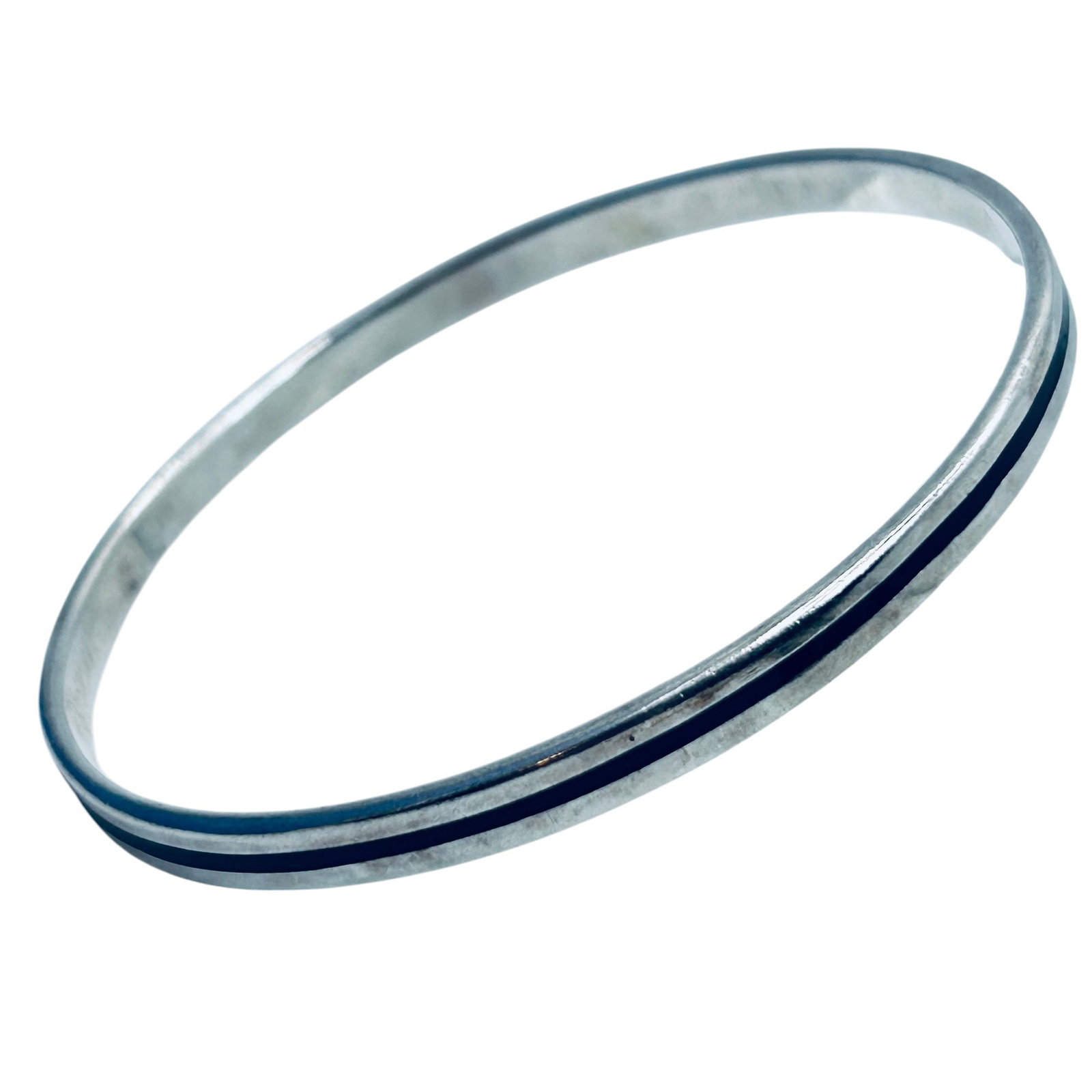 GM, Sterling Silver Bangle Bracelet With Black Stripe. 15.96 G. Unknown Mark.: GM sterling silver bangle bracelet with black stripe. 15.96 g. Unknown mark.