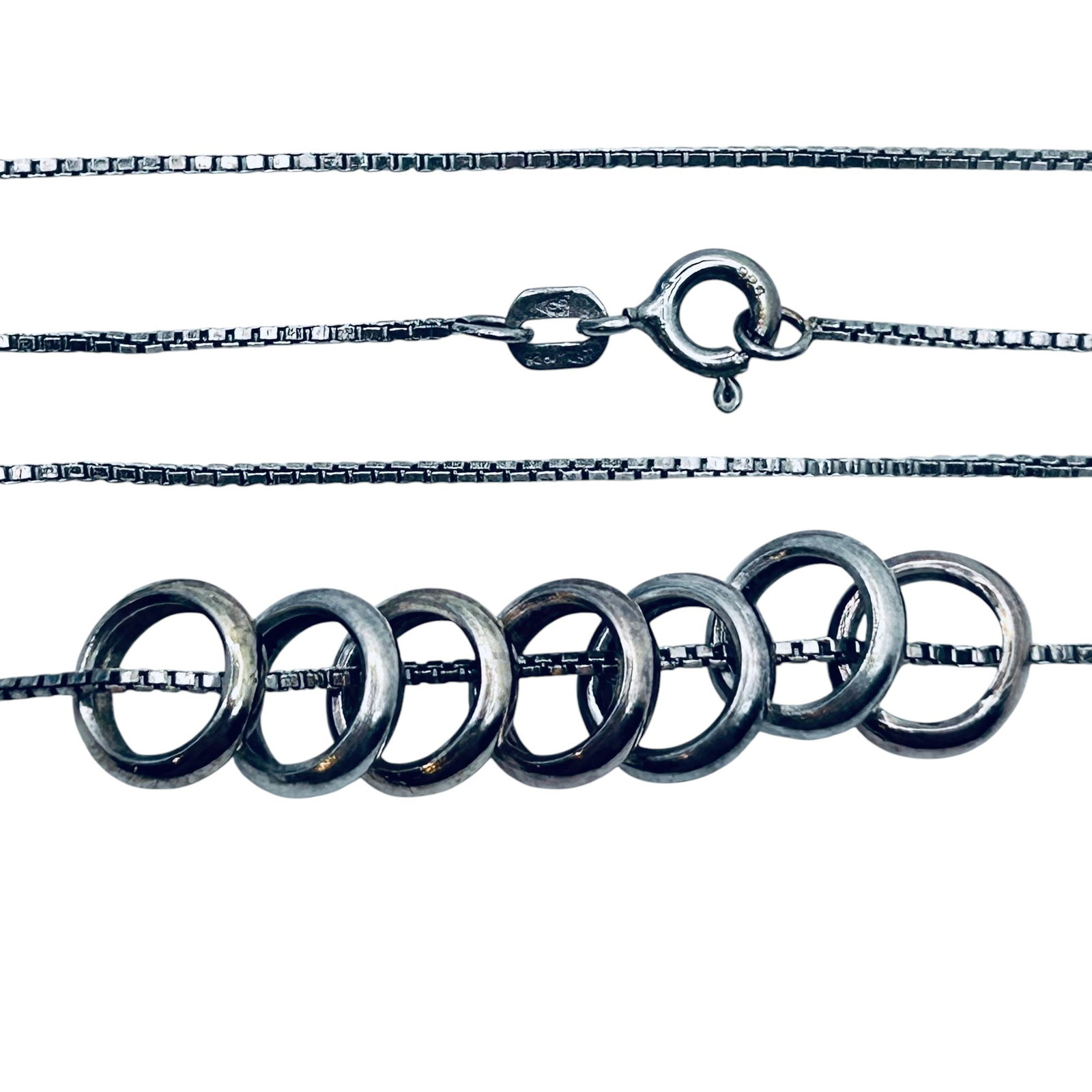 IBB Italy Sterling Silver Box Chain Necklace With Six Ring Pendants. 4.48 G.: IBB Italy sterling silver box chain necklace with six ring pendants. 4.48 g.