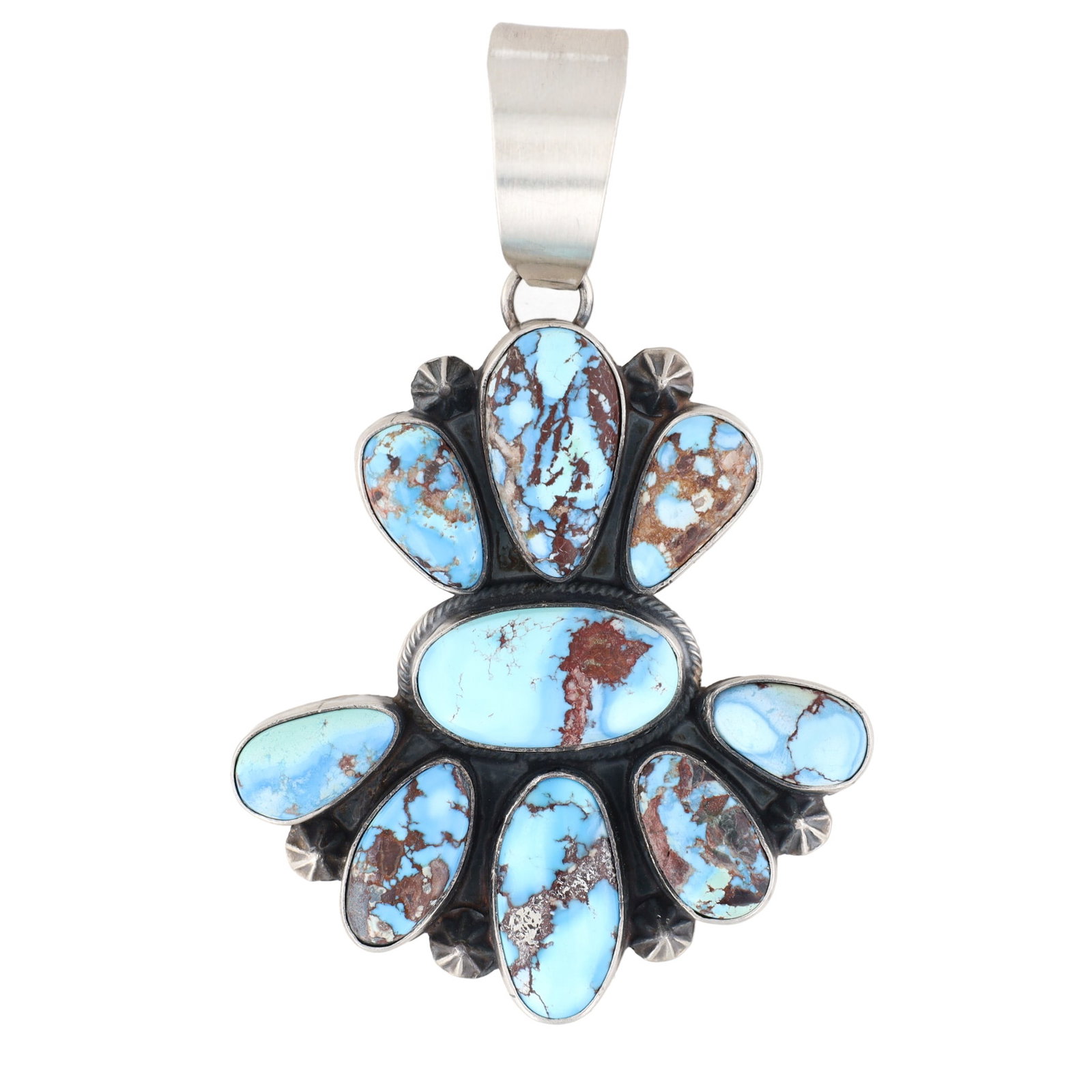 Sherly Martinez Navajo Golden Hills Turquoise Cluster Sterling Silver Pendant: A Navajo Golden Hills Turquoise cluster pendant by Sherly Martinez. This sterling silver pendant features a cluster arrangement of nine light blue cabochon stones with visible brown matrixing, set aro