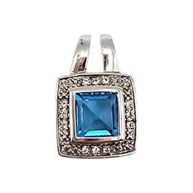 Sterling Silver Pendant with Blue Topaz and Clear Accents, 2.1 G