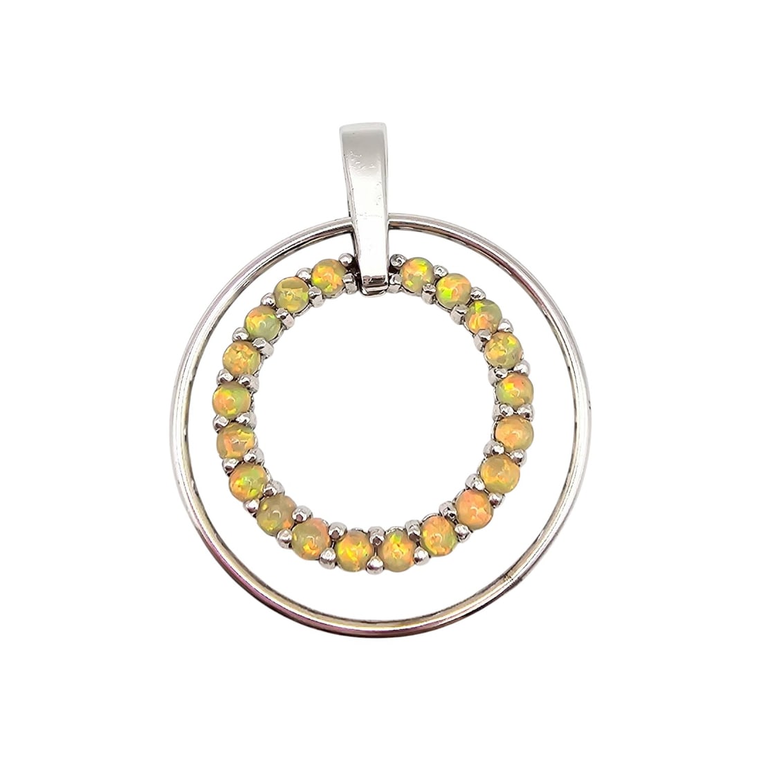 FAS Sterling Silver and Opal Pendant, 5.8 G: FAS pendant crafted from sterling silver featuring a circular design with a central ring adorned with polished opal stones. The pendant weighs 5.8 grams and has a sturdy bail for easy attachment to ch