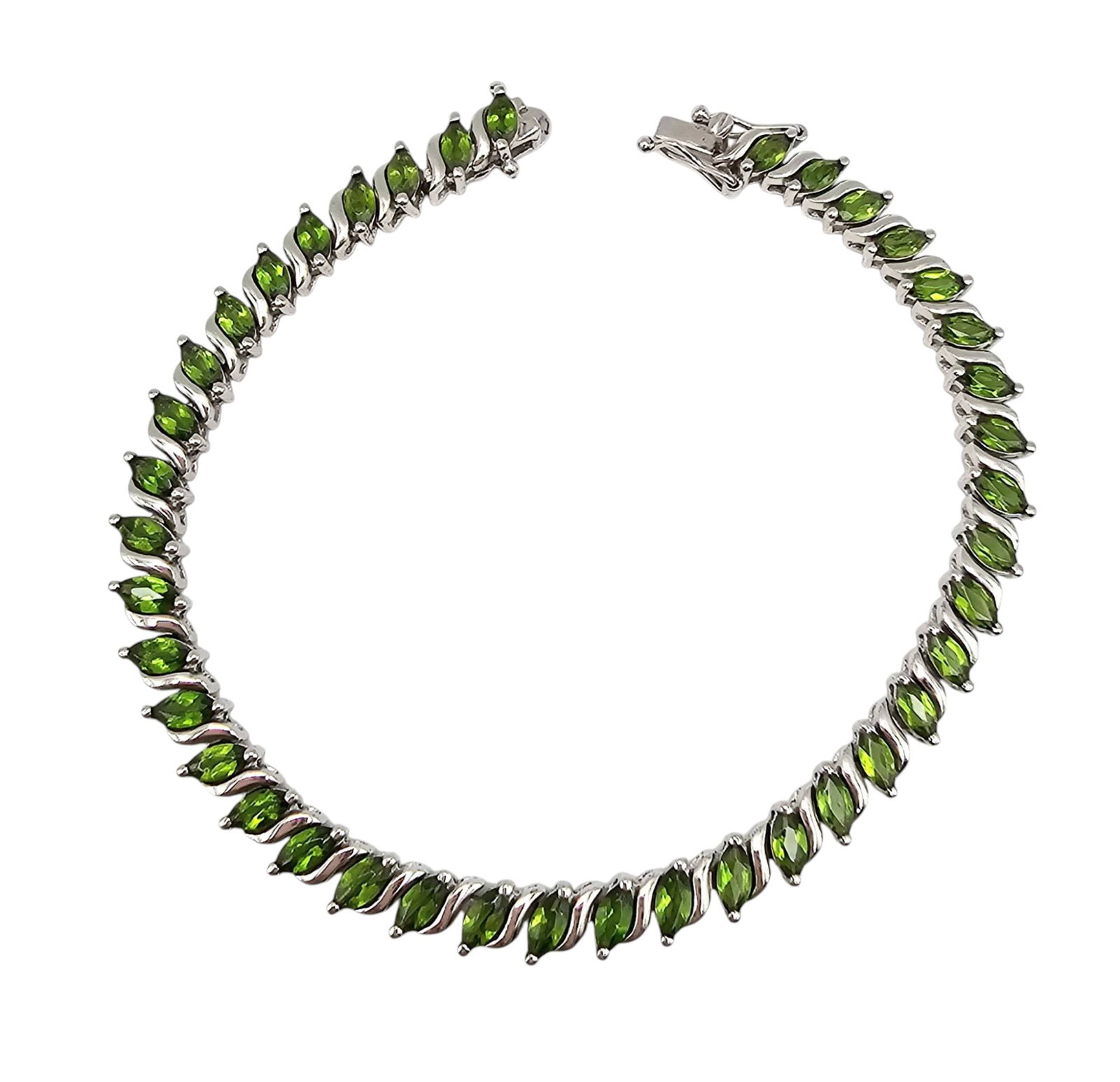 Sterling Silver Peridot Tennis Bracelet with Safety Clasp, 12.5 G: Sterling silver tennis bracelet featuring vibrant marquise-cut peridot gemstones. Total weight is approximately 12.5 grams. The bracelet includes a secure safety clasp closure for added functionality.