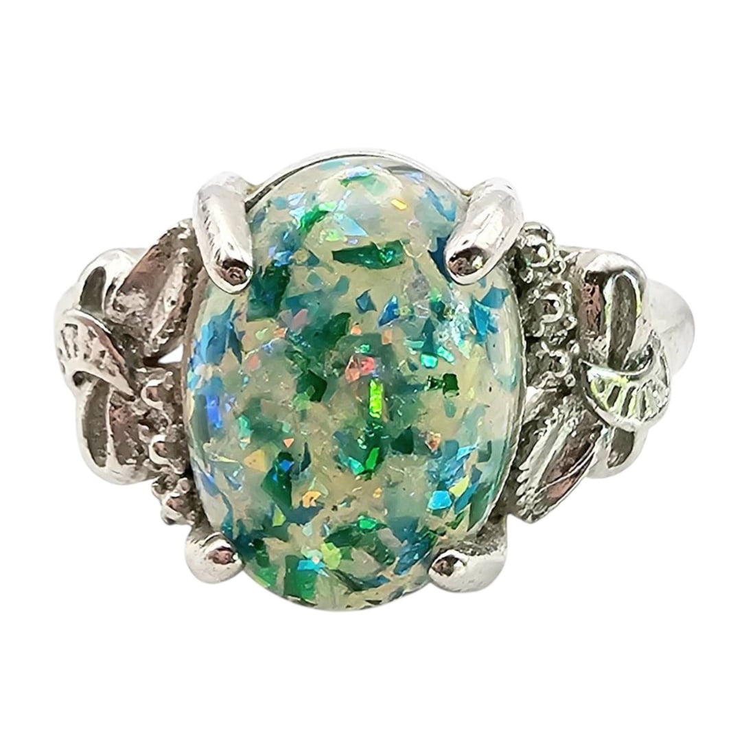 Sterling Silver Ring with Glass Stone, 3.2 G: Sterling silver ring featuring an oval-shaped glass stone with vibrant blue-green colors. The ring size is approximately 8.75, and it weighs 3.2 grams. Decorative floral accents are present on the ban