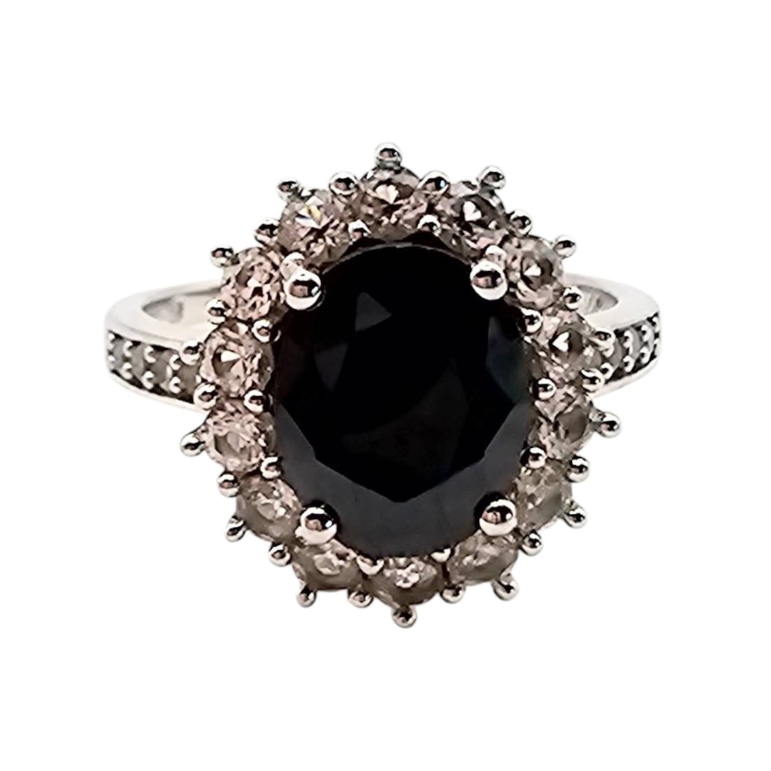 CN Sapphire Sterling Silver Ring, Size 8, 4.7 G: Sterling silver ring featuring a dark sapphire centerpiece surrounded by a halo of smaller stones. The ring is hallmarked 'CN'. Size 8 and weighs 4.7g. Elegant design with detailed accents on the band