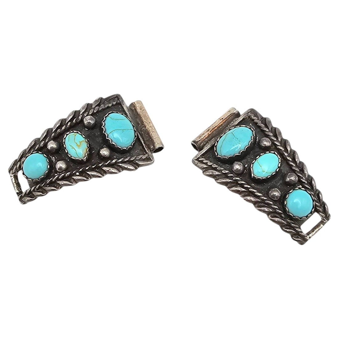Native Southwestern Sterling Watch Nibs with Turquoise Inlay: Native Southwestern watch nibs crafted from . sterling silver, adorned with turquoise cabochon inlays. Each piece features intricate rope and beadwork designs, weighing a total of 7.3 grams. The back