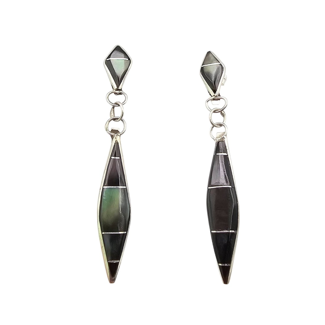 James Kee Zuni Sterling and Black Onyx Earrings: Sterling silver and black onyx earrings, crafted by Zuni artist James Kee. Features inlaid black onyx and a geometric, elongated design. Earrings measure approximately 2.25 inches in length. Weight is