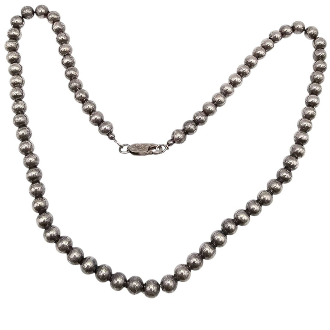 Sterling Bead Necklace with Clasp: Sterling silver bead necklace featuring uniformly sized beads strung together and secured with a clasp. The necklace weighs approximately 30.5 grams, as shown. The overall length is displayed against