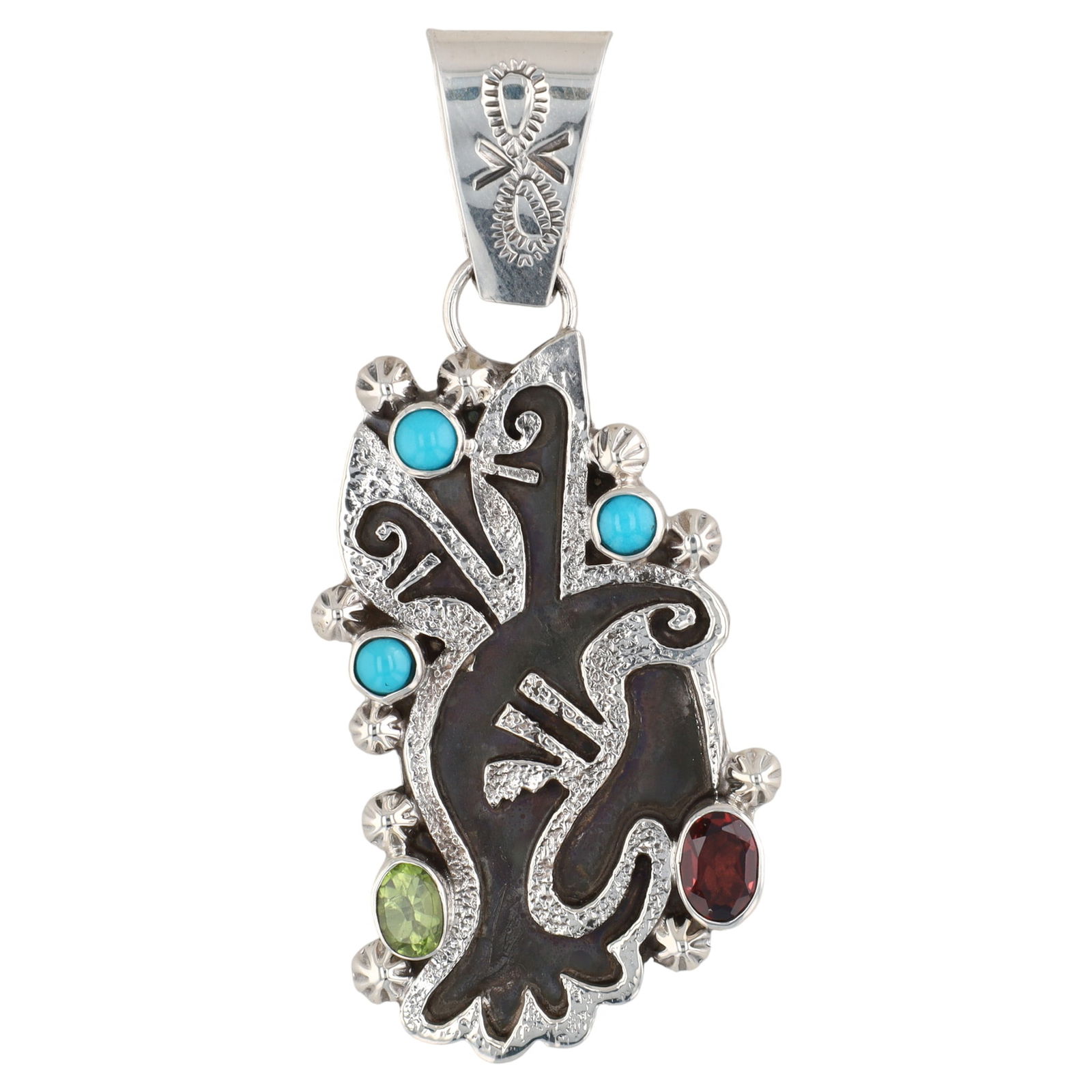 Navajo Sheena Jack Couture Hummingbird Pendant: A sterling pendant featuring a stylized oxidized hummingbird design adorned with three light blue turquoise, one green peridot, and one red garnet stone, bearing a maker's mark of "RB 925" for Running