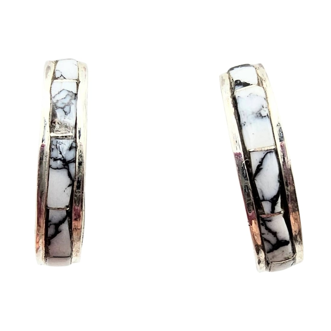 Jamie Johnson Navajo Sterling White Buffalo Earrings: Navajo handmade sterling silver hoop earrings by artisan Jamie Johnson featuring white buffalo stone inlay. The earrings weigh 3.2 grams and include sterling silver barrel clasps. The interior is stam