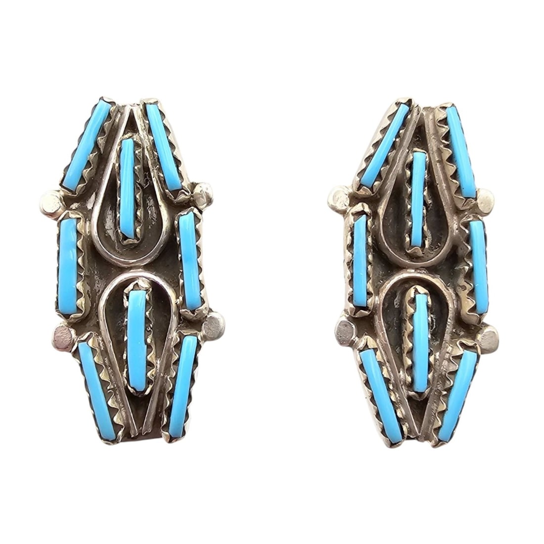 Davis KaaMasee Zuni Sterling Kingman Turquoise Earrings: Handmade earrings by Davis KaaMasee, a Zuni artist. The earrings feature sterling silver construction and are set with Kingman turquoise stones. Each earring is stamped 'Sterling,' and they are design