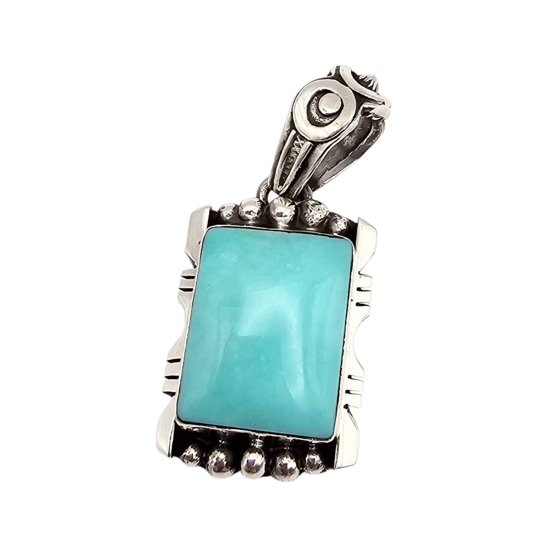 Navajo Sterling Kingman Turquoise Pendant by Phyllis Smith: Navajo handmade sterling silver pendant crafted by Phyllis Smith, featuring a rectangular Kingman turquoise stone set into a detailed silver design. The pendant weighs approximately 10.2 grams and sho