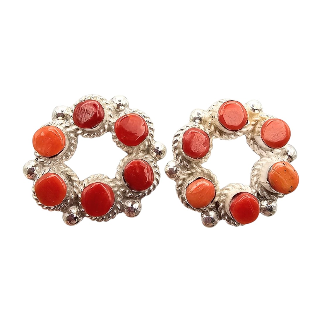 Janice Lalio Zuni Sterling Red Coral Earrings: Handmade earrings by Janice Lalio, featuring sterling silver construction and set with red coral stones. These earrings are circular in design and signed on the back. They weigh approximately 8.6 gram