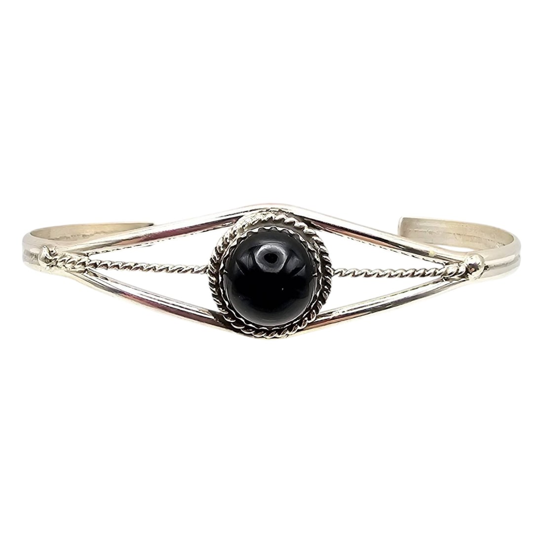 Sterling Black Onyx Bracelet by Esther White, Navajo Handmade: Handmade sterling silver bracelet featuring a central black onyx stone. Crafted by Navajo artist Esther White using traditional techniques. The bracelet includes intricate silverwork with a single bra