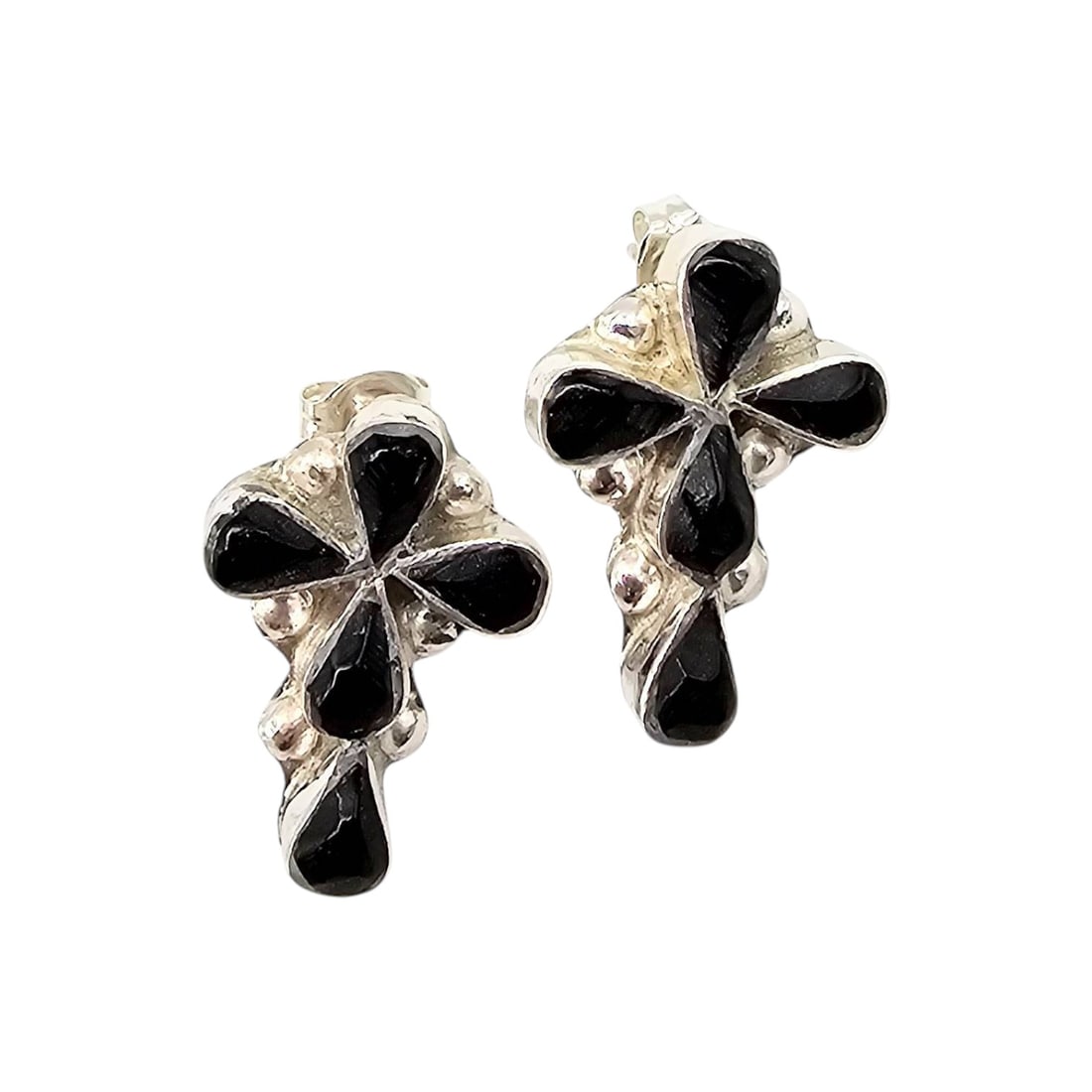 Pino Yunie Zuni Sterling Black Onyx Earrings: Handmade earrings by Pino Yunie in the Zuni tradition. Crafted from sterling silver, these earrings feature black onyx inlay in a striking design. The earrings are lightweight at 3.3 grams and include