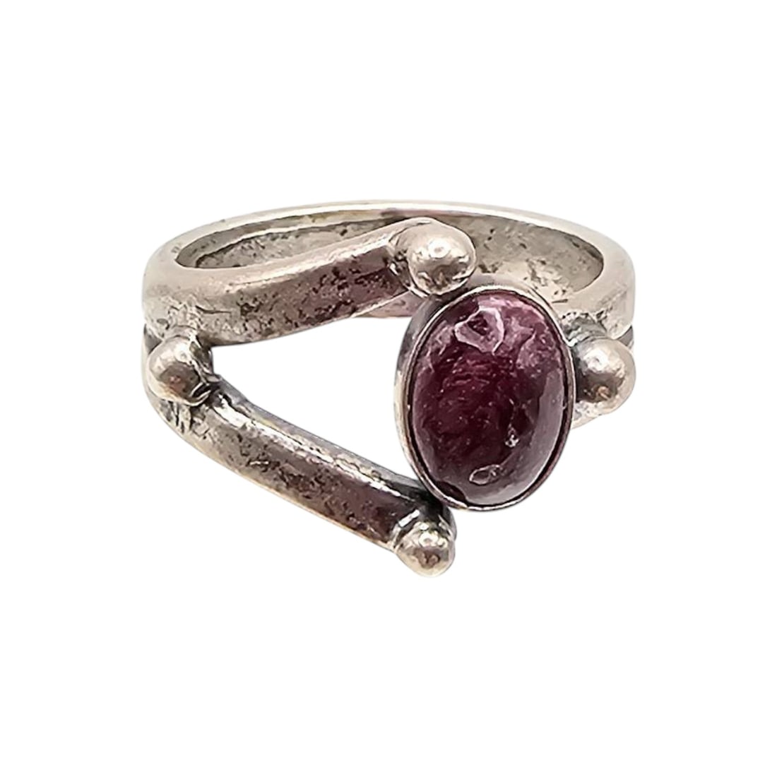 Tom Lewis Navajo Adjustable Sterling Spiny Oyster Ring: Adjustable ring crafted by Navajo artisan Tom Lewis, featuring sterling silver and a spiny oyster cabochon stone. Weighs approximately 5 grams and displays distinctive handmade elements consistent wit