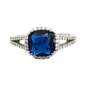 Sterling Blue Rhinestone with Clear Rhinestones surrounding Ring Size 7.25, 3.25g,