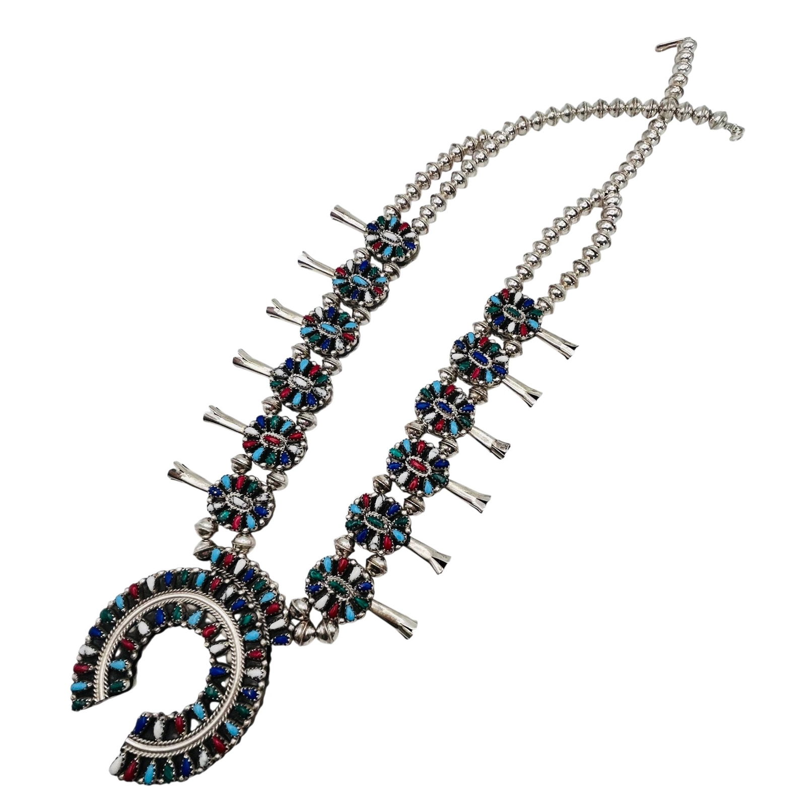Milton James Navajo Sterling Multistone Reversible Squash Necklace: Milton James Navajo Sterling reversible Squash Necklace. Navajo pearls and Beautiful turquoise reverses to turquoise lapis lazuli coral and Malachite. approximately 24 inches and 138 g.