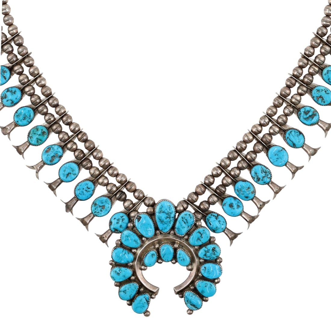 Richardson's Trading Post Henry Roanhorse Navajo Sterling Turquoise Squash Blossom: Presented in partnership with the historic Richardson’s Trading Post, a cornerstone of Native American jewelry since 1913. Selected from their archives of rare vintage and contemporary pieces. Henry