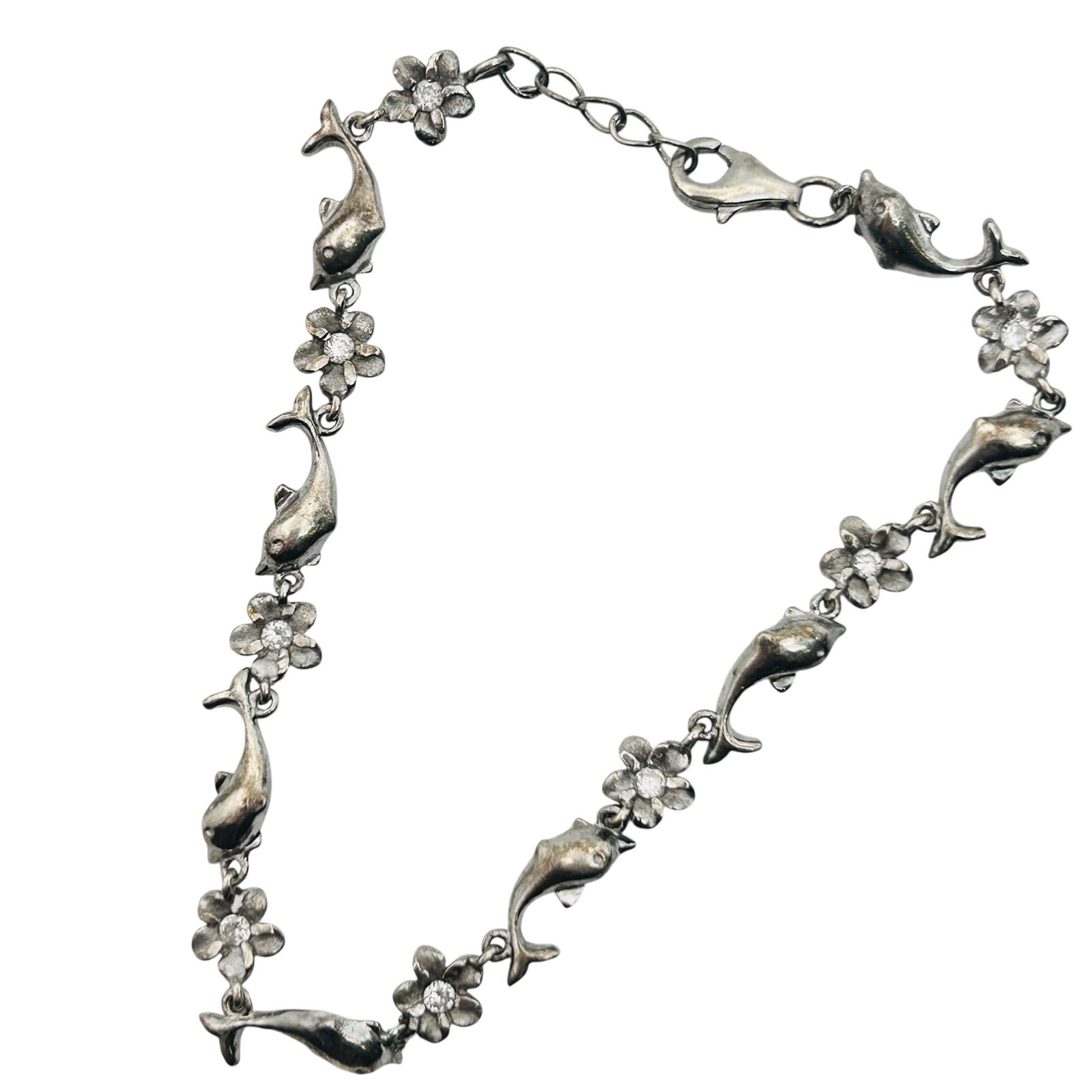 Sterling Rhinestone Dolphin Flower Bracelet: Sterling rhinestone dolphin flower bracelet. 5.30g