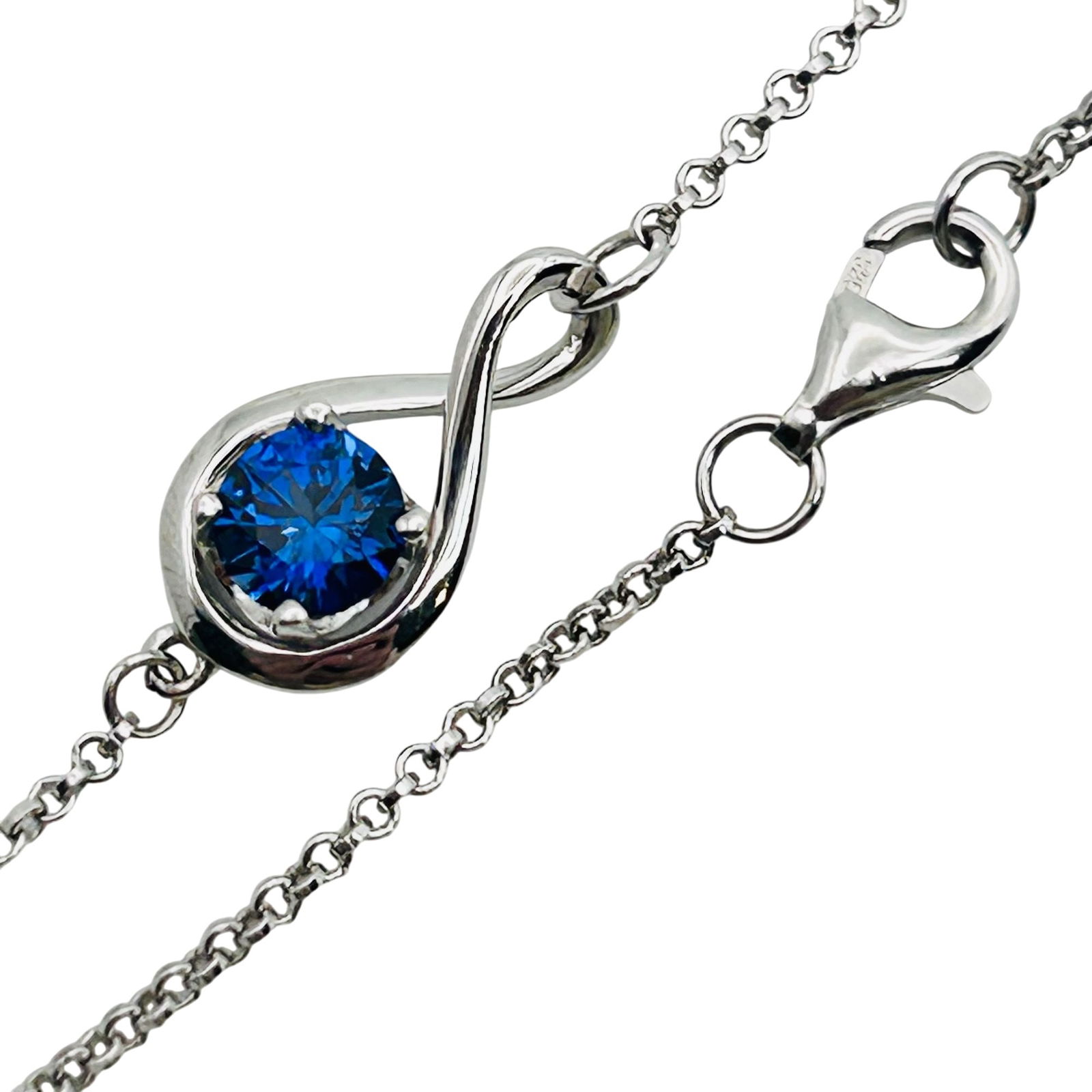 Sterling Sapphire Infinity Pendant Cable Chain Bracelet: Sterling sapphire infinity pendant cable chain bracelet. 1.90g