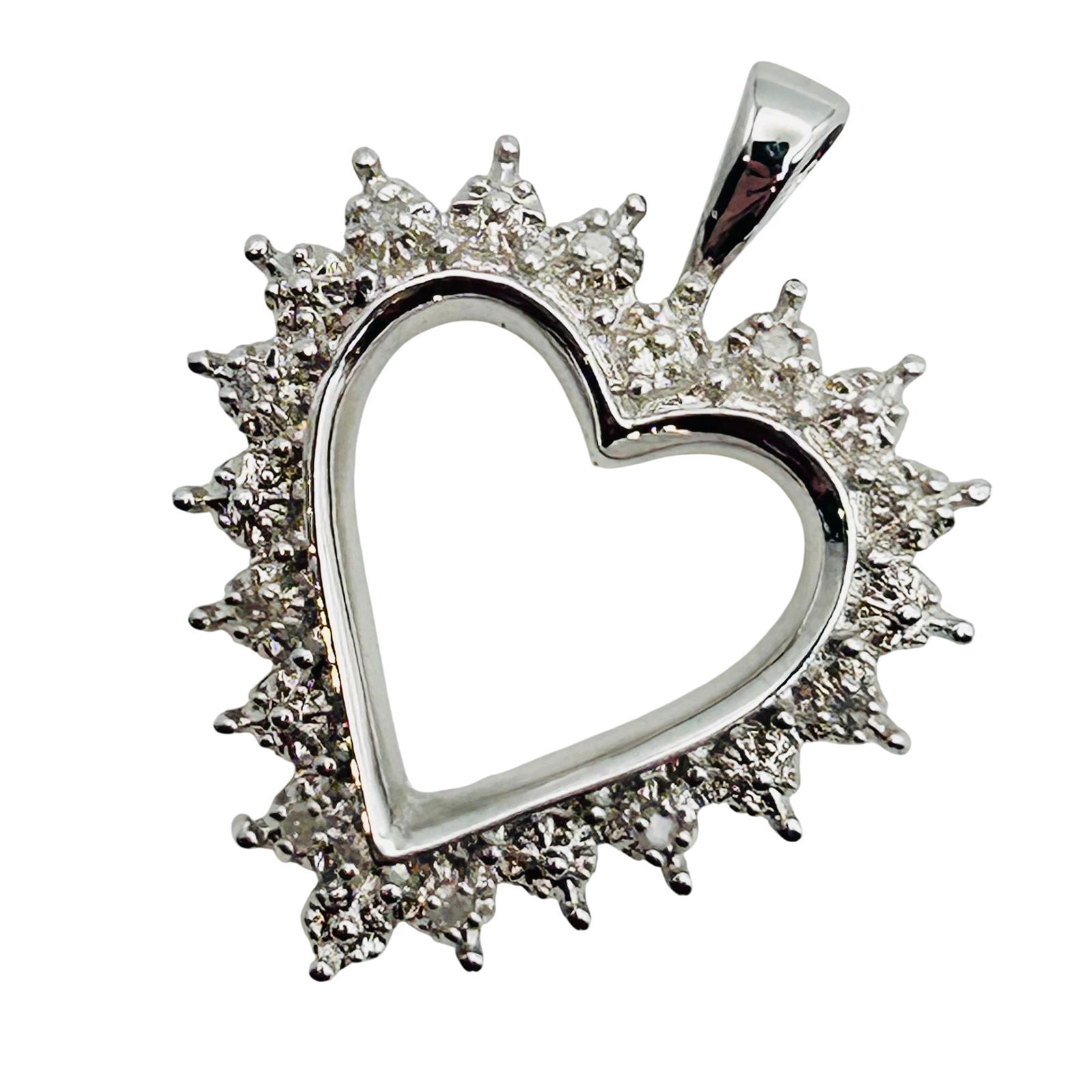 Sterling Diamond Accent Heart Pendant: Sterling Diamond accent heart pendant. 2.90g