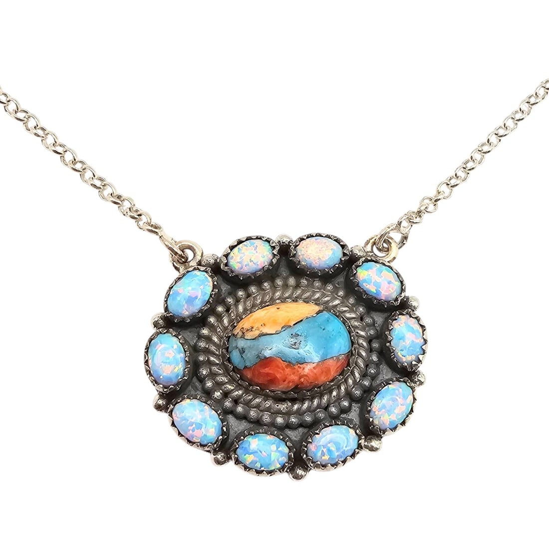 Hada Collection Sterling Silver Multi-Stone Necklace: Hada Collection sterling silver necklace featuring a central multi-stone design, including vibrant turquoise, spiny oyster,coral and opal accents. The detailed pendant is marked 'sterling' and 'Hada'