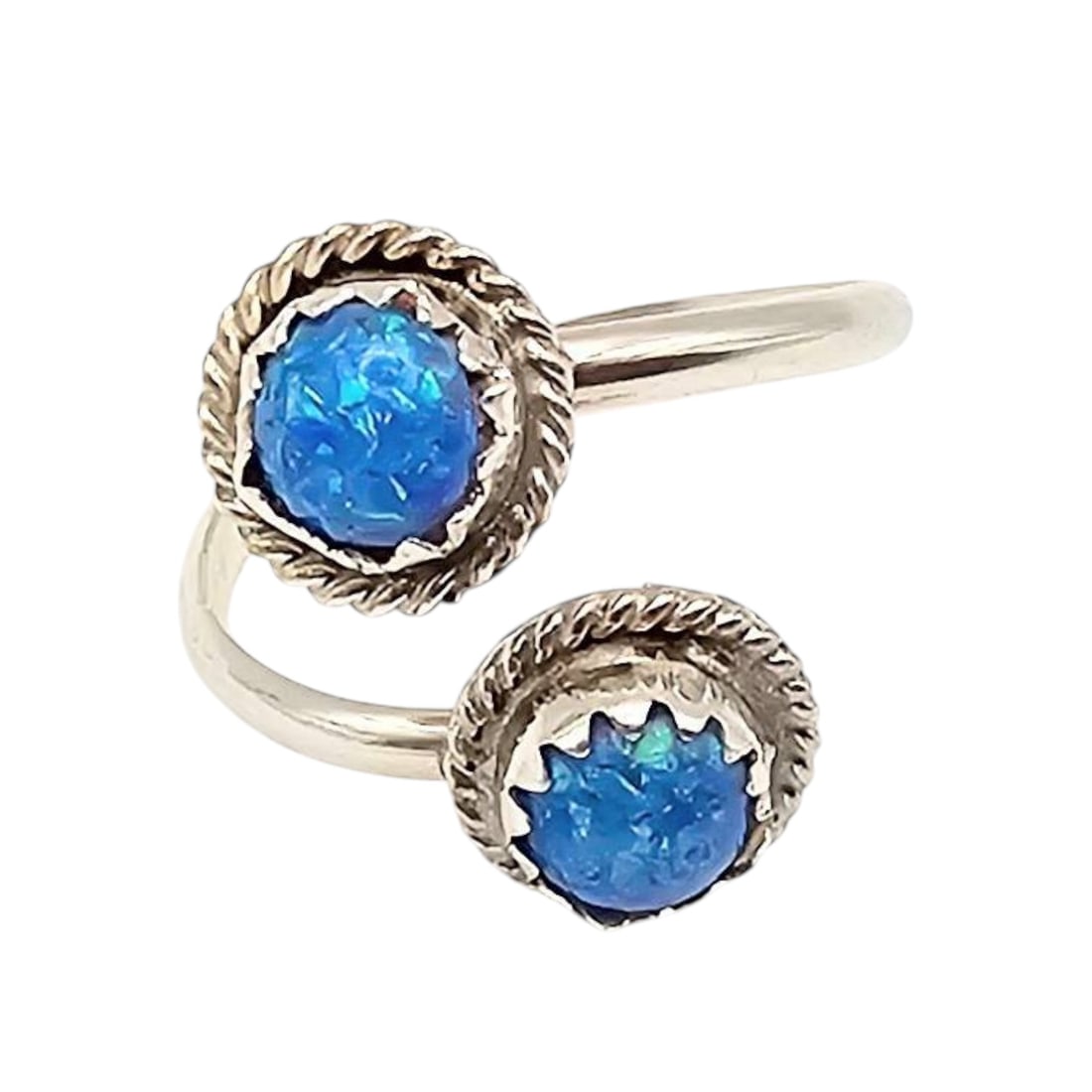 Esther White Sterling Silver Adjustable wrap Opal Navajo Ring: Sterling silver adjustable ring wrap ring featuring two vibrant opal stones. Handcrafted by Navajo artisan Esther White. The ring showcases a twisted rope design around the stones, emphasizing the cra