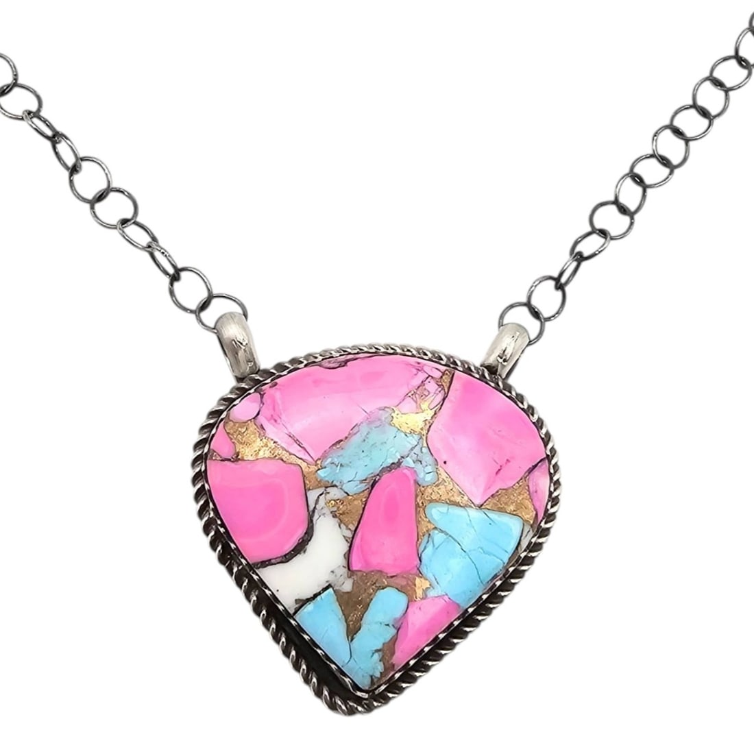 Tia Long Navajo Handmade Cotton Candy Sterling Silver Necklace: Sterling silver necklace handmade by Navajo artist Tia Long, featuring a teardrop-shaped pendant with a mosaic inlay of pink, blue, and white stones, resembling a 'cotton candy' theme. The pendant is