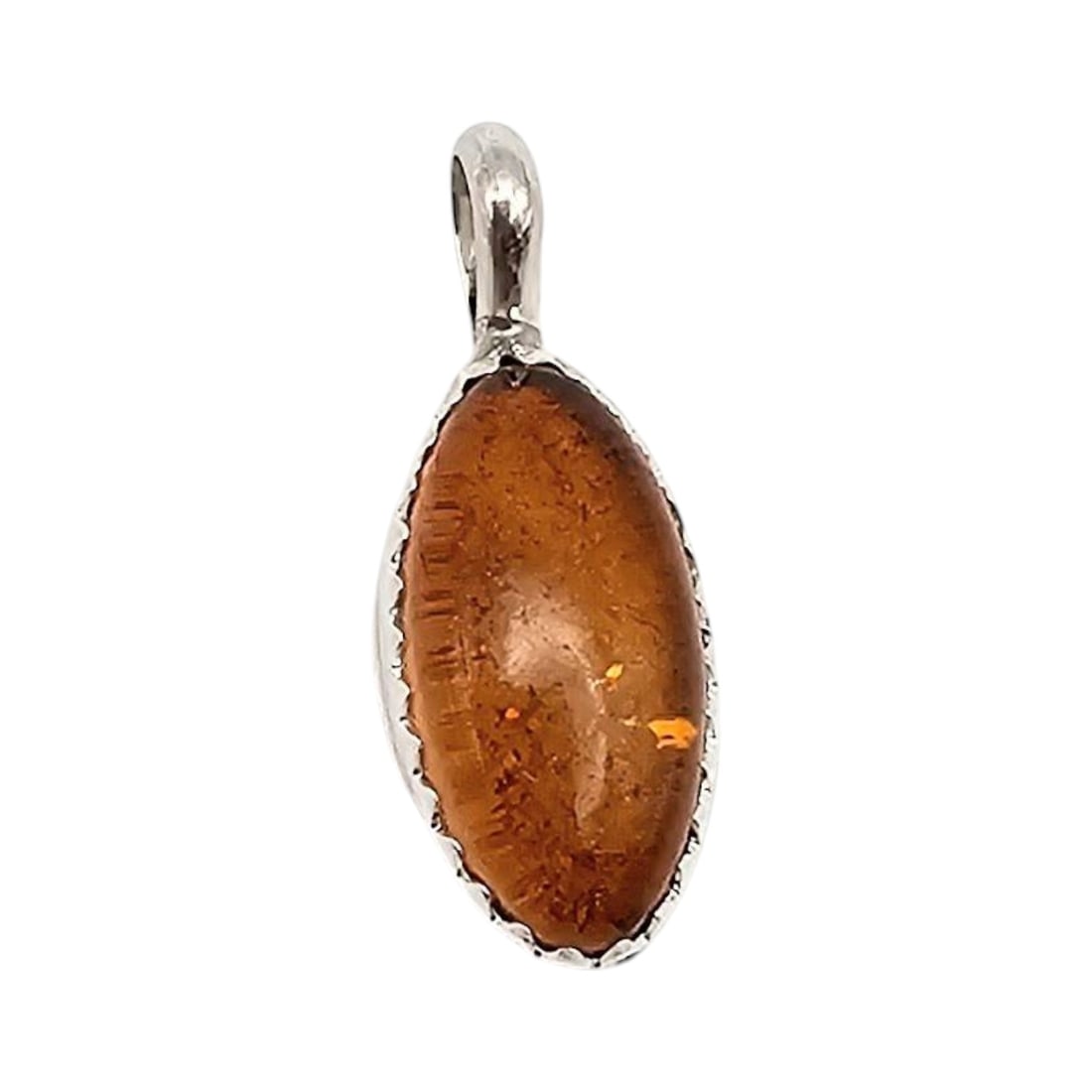 Dorothy Yazzie Navajo Sterling Silver Amber Pendant: Sterling silver pendant handcrafted by Navajo artist Dorothy Yazzie. Features an amber-colored stone in an oval bezel setting with a polished silver back and integrated bail for a chain. Weighs